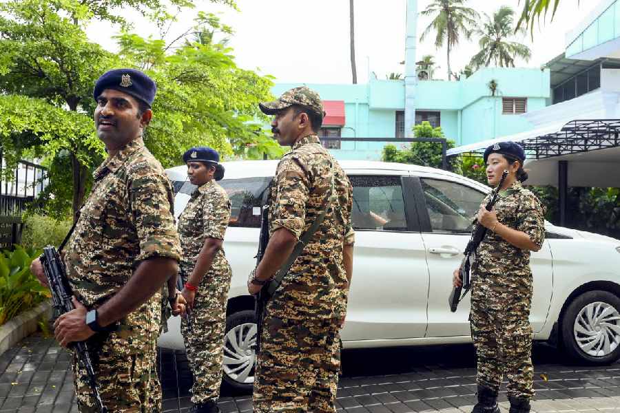 Security personnel stand guard