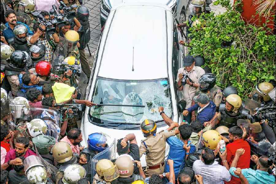 CPM activists attack a vehicle carrying ED officials outside Pinarayi Vijayan’s residence in Thiruvananthapuram on Wednesday.