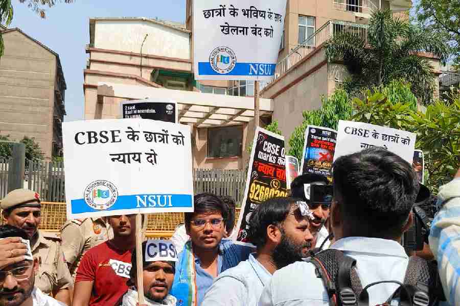 National Students' Union of India (NSUI) members stage a protest