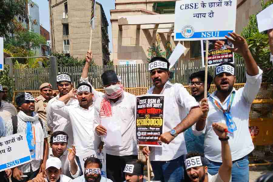 National Students' Union of India (NSUI) members stage a protest