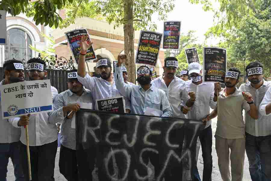 National Students' Union of India (NSUI) members stage a protest