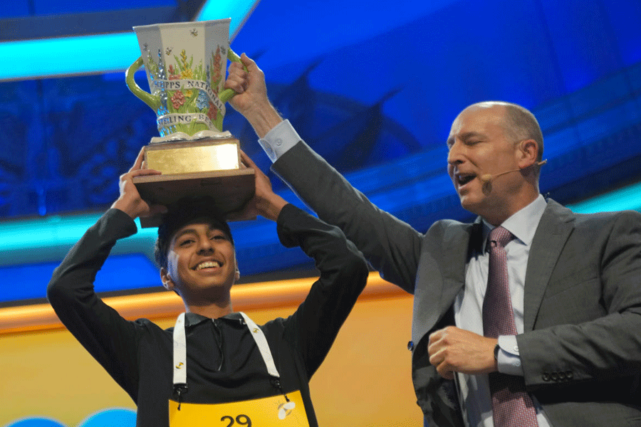 E.W. Scripps Company president and CEO Adam Symson, right, holds the trophy over winner of the 2026 Scripps National Spelling Bee, Shrey Parikh, 14, of Rancho Cucamonga, Calif., at DAR Constitution Hall, Thursday, May 28, 2026, in Washington.