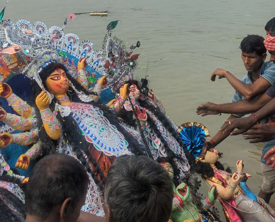 After the boron rituals, the idol of Goddess Durga at Baghbazar was taken to the ghat for immersion on Wednesday.