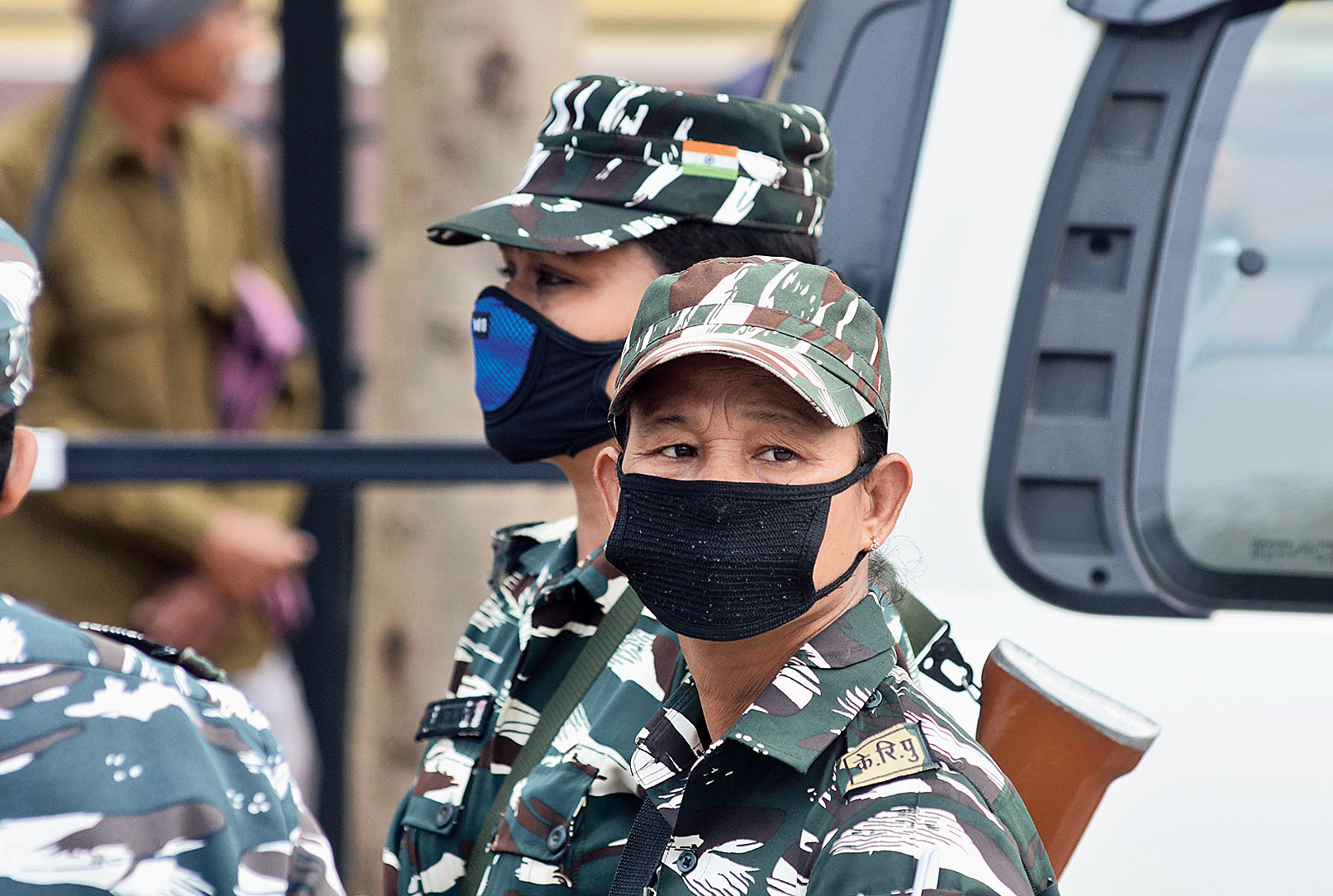 Security personnel wear protective masks in  Guwahati on Friday