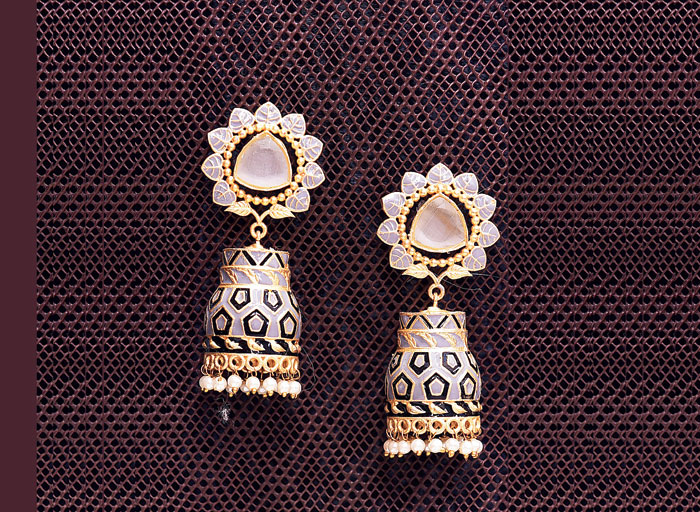 Dazzle up your Diwali night look with this pair of brass-and-copper earrings embellished with Jodhpuri pearls and meenakari work. Rs 700 @Kayra; find them at 58/3 Sura Cress Lane, CIT Road