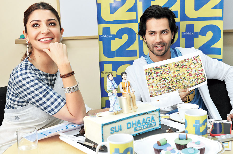 Varun Dhawan and Anushka Sharma try to figure out the stitch pattern