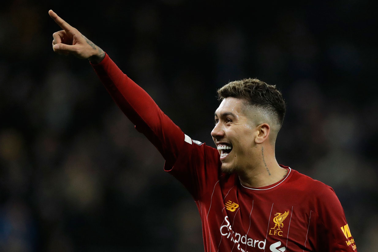Liverpool's Roberto Firmino celebrates at the end of the English Premier League football match between Tottenham Hotspur and Liverpool at the Tottenham Hotspur Stadium in London, England on Saturday