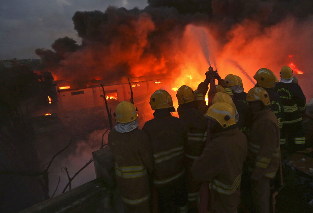 Firefighters work to control a fire at a chemical factory in Chennai, on Saturday