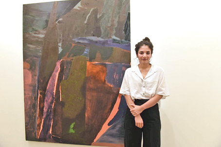 Biraaj Dodiya at the opening of her show Stone Is A Forehead at Experimenter, Hindustan Road, photographed in front of her painting titled Sirens