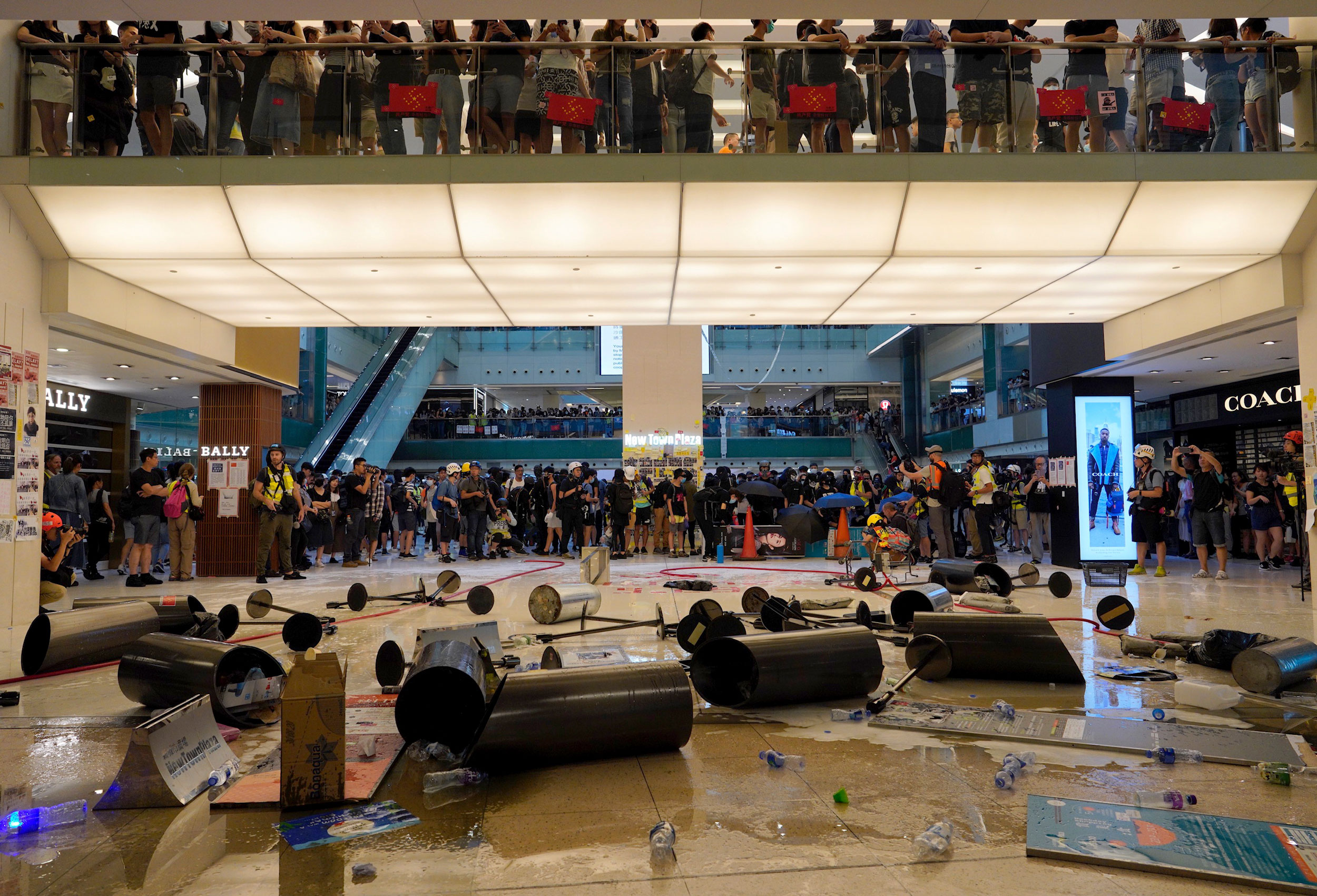 Protesters pour cooking oil and scatter debris to block the entrance to a subway station in Hong Kong on September 22, 2019. 