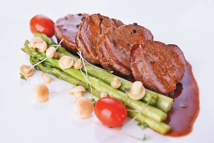 Classic Tenderloin Steak served with Thai asparagus and jus.