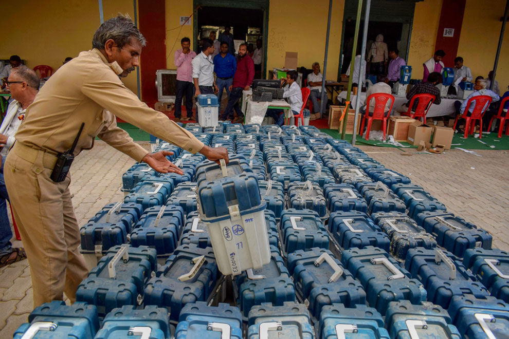 A polling official arranges VVPATs at a distribution centre for the upcoming fifth phase of the 2019 Lok Sabha elections, in Prayagraj, on May 03, 2019.