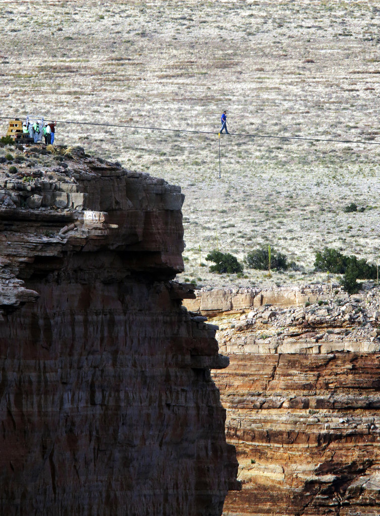 In this June 23, 2013, file photo, daredevil Nik Wallenda crosses a tightrope 1,500 feet above the Little Colorado River Gorge, Arizona, on the Navajo Nation outside the boundaries of Grand Canyon National Park.