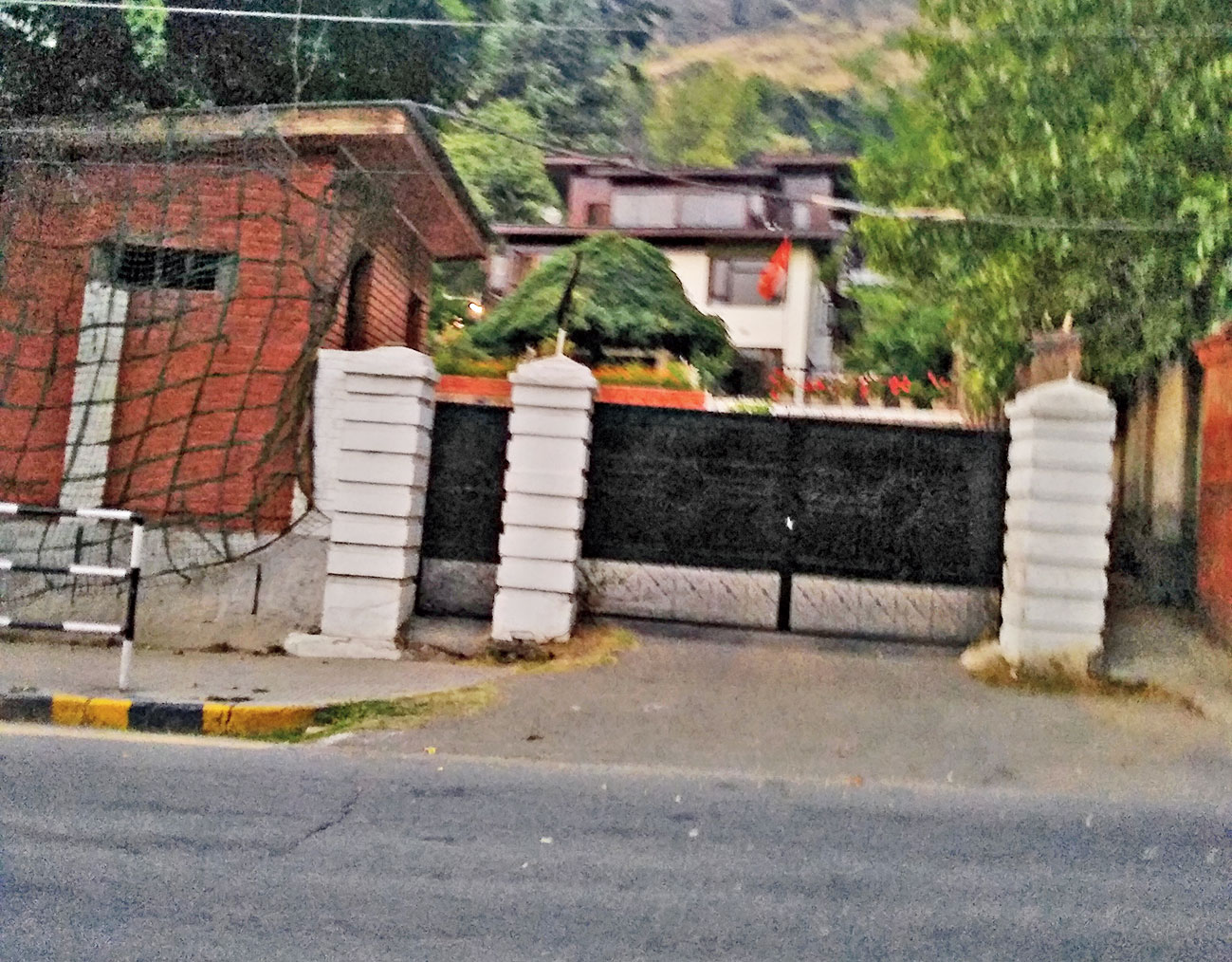 The black flag Farooq’s daughter Safiya hoisted atop the gate of her house