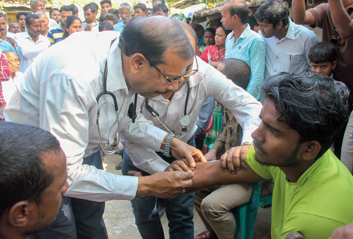 Doctors check villagers at the medical camp set up after the tragedy at Santipur. 