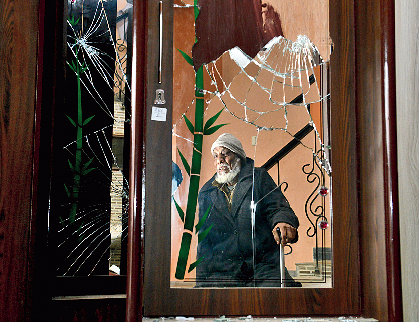 Haji Hamid Hasan at his home in Muzaffarnagar. Some scars of the vandalism allegedly committed by policemen are visible.