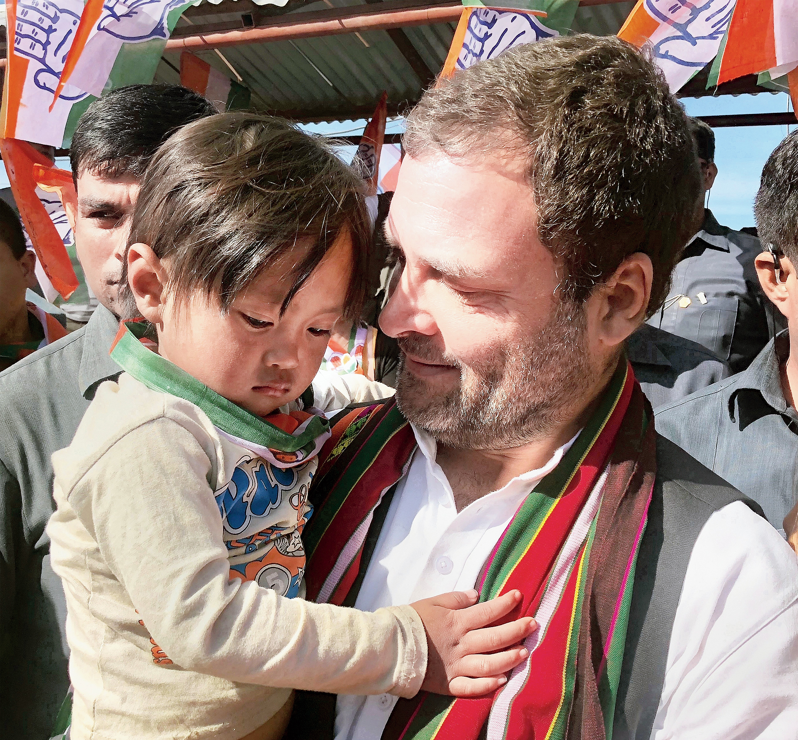 Congress president Rahul Gandhi holds a child during an election rally in Champhai in Mizoram on Tuesday. 