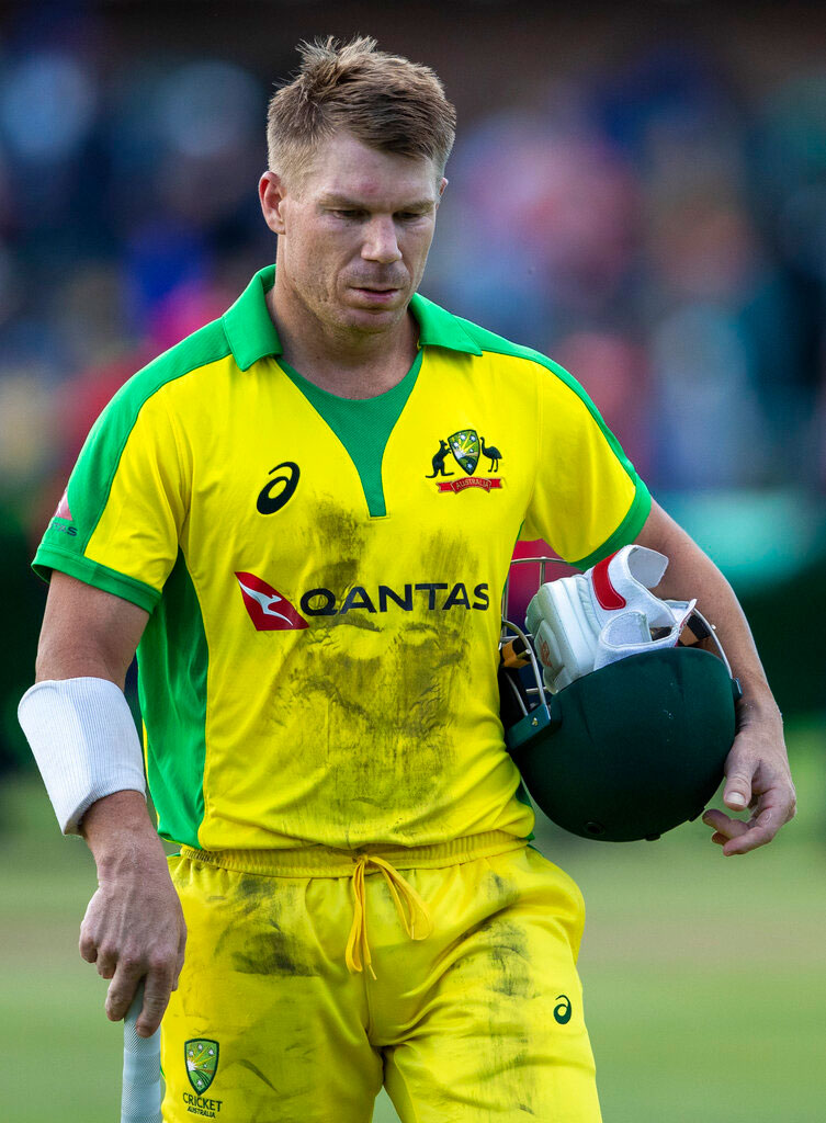 David Warner walks back to the players pavilion at the end of the 2nd T20 cricket match between South Africa and Australia in Port Elizabeth on Sunday