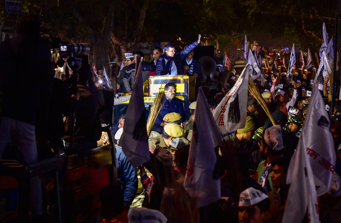 Delhi Chief Minister Arvind Kejriwal during an election campaign roadshow ahead of Delhi Assembly elections, at Sarojini Nagar in New Delhi, Wednesday