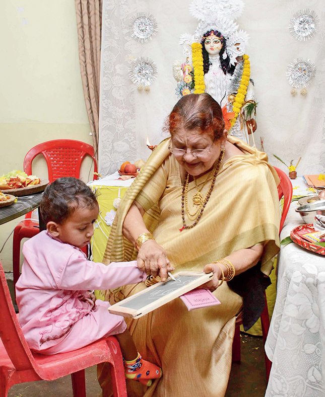 She performs hathey khori for a two-year-old at the AD Block centre.