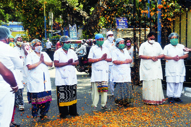 Say it with flowers: Flower petals being showered on nurses at SSKM Hospital on International Nurses Day on Tuesday. 