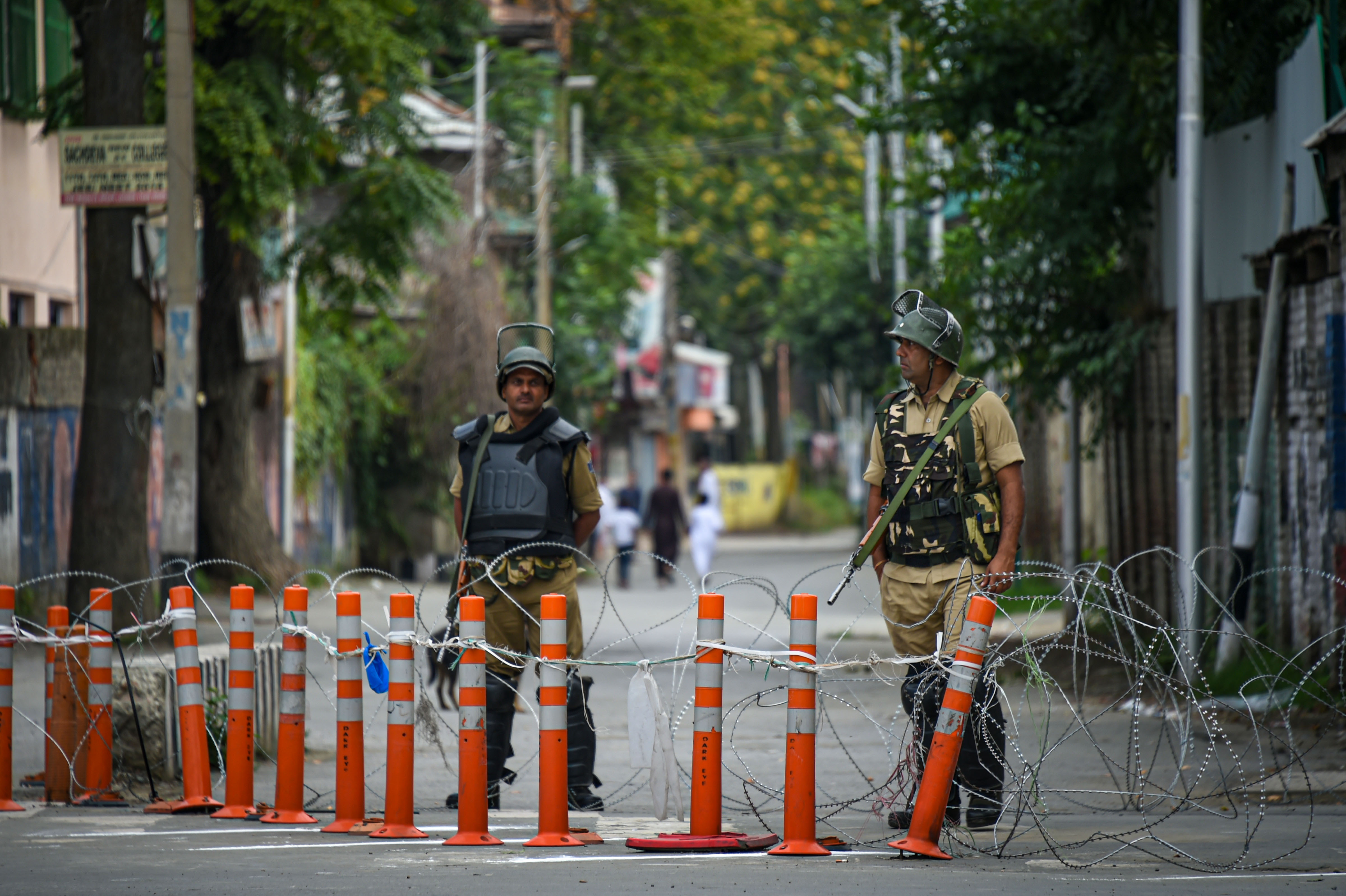 Security personnel stand guard  in Srinagar on August 12.