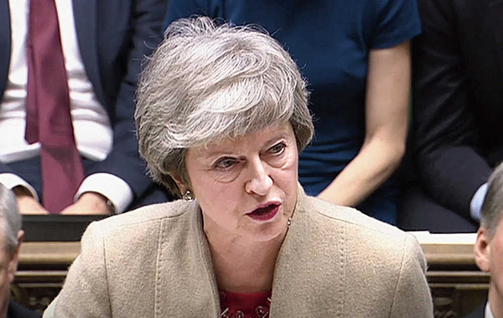 Prime Minister Theresa May  answers a question at the House of Commons. 
