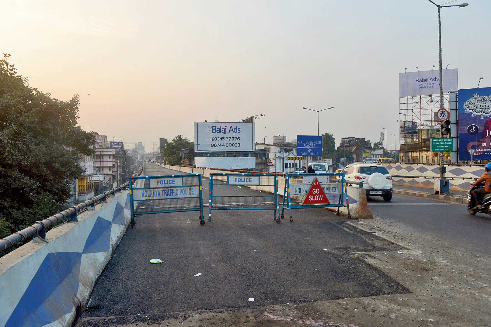 Guard rails at the mouth of the ramp that branches off the Parama flyover and merges with the AJC Bose Road flyover. 
