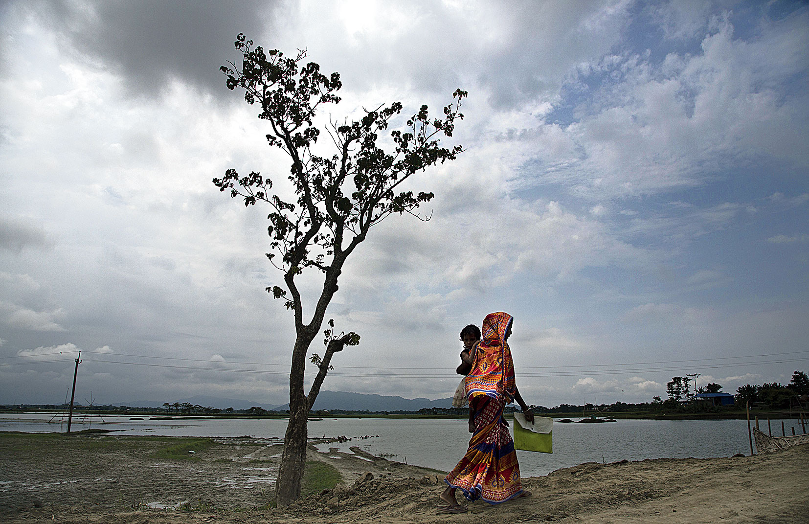 A woman on her way to check her name in the final National Register of Citizens in Morigaon, Assam, on Saturday. 