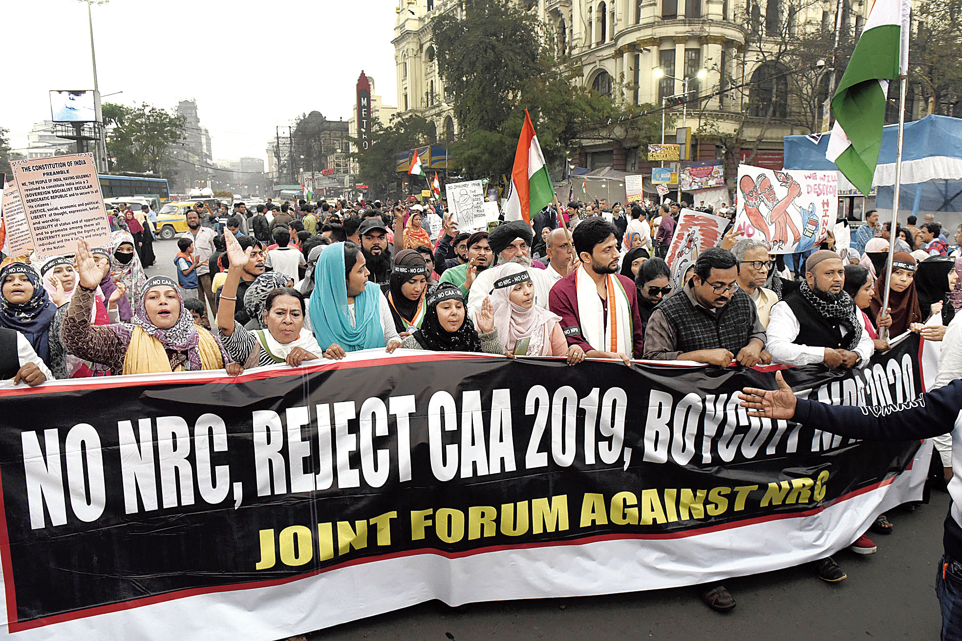Actor Mohammed Zeeshan Ayyub (in maroon), Prasenjit Bose (to Ayyub’s left) of the Joint Forum Against NRC and others walk towards the Gandhi statue on Mayo Road from the sit-in venue near New Market on Thursday.