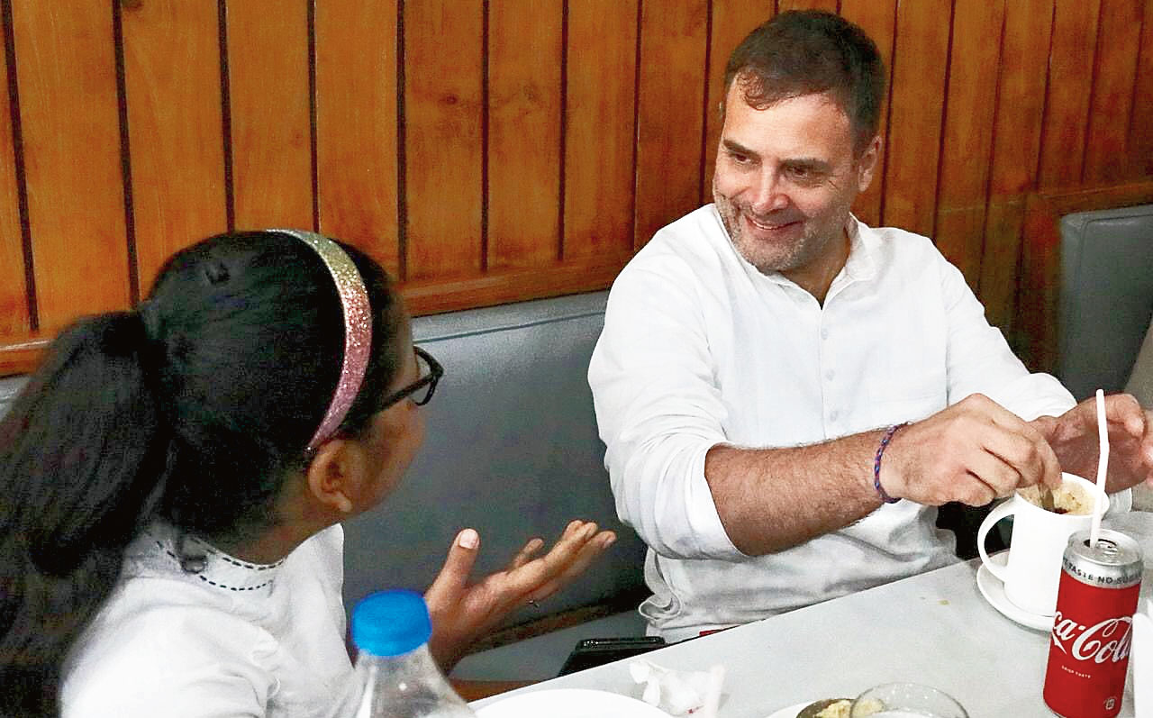 Rahul Gandhi chats with a girl at Basant Vihar restaurant in Patna, where he stopped on the way back to the airport. Congress legislator Prem Chandra Mishra, who shared the table with Rahul, said: “He was hungry and asked us to stop near Maurya Lok. We hurried to the restaurant, but the ground floor was packed. We went up to the first floor and luckily got two tables after waiting for a couple of minutes.” Families dining at the restaurant rushed to click selfies with Rahul, but he requested them to let him eat first as he was famished. He gave them time after finishing his meal of medu vada, dosa, coffee and a can of cold drink. The girl, who was with her mother, came and sat next to Rahul who chatted with her and the young son of a Congress MLA who had come with his father to see him. Rahul was at the restaurant for 40 minutes.