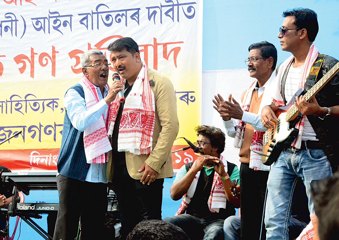 Singers Surjya Das and Krishna Moni Nath perform at the rally in Nagaon on Wednesday. 
