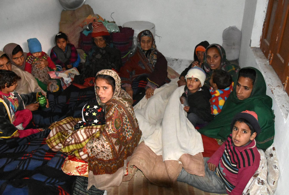 Villagers take shelter at a shrine after shelling by the Pakistani Army near the LoC, at Mendhar in Poonch district, on Wednesday. 