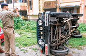 A policeman on Wednesday records a jeep allegedly overturned by junior doctors and MBBS students on the medical college campus. 
