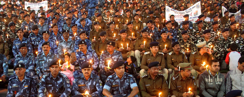 Jawans light candles pay tribute to martyred CRPF jawans, who lost their lives in Pulwama terror attack, in Bhopal,  Saturday, Feb.16, 2019.