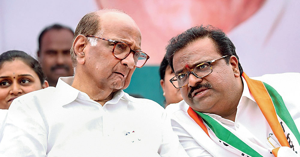 NCP chief Sharad Pawar with party candidate (right) Samir Bhujbal in Nashik on April 11