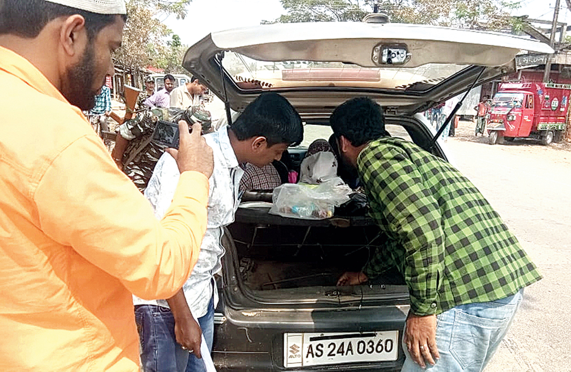 Flying squad members check a vehicle in Hailakandi.
