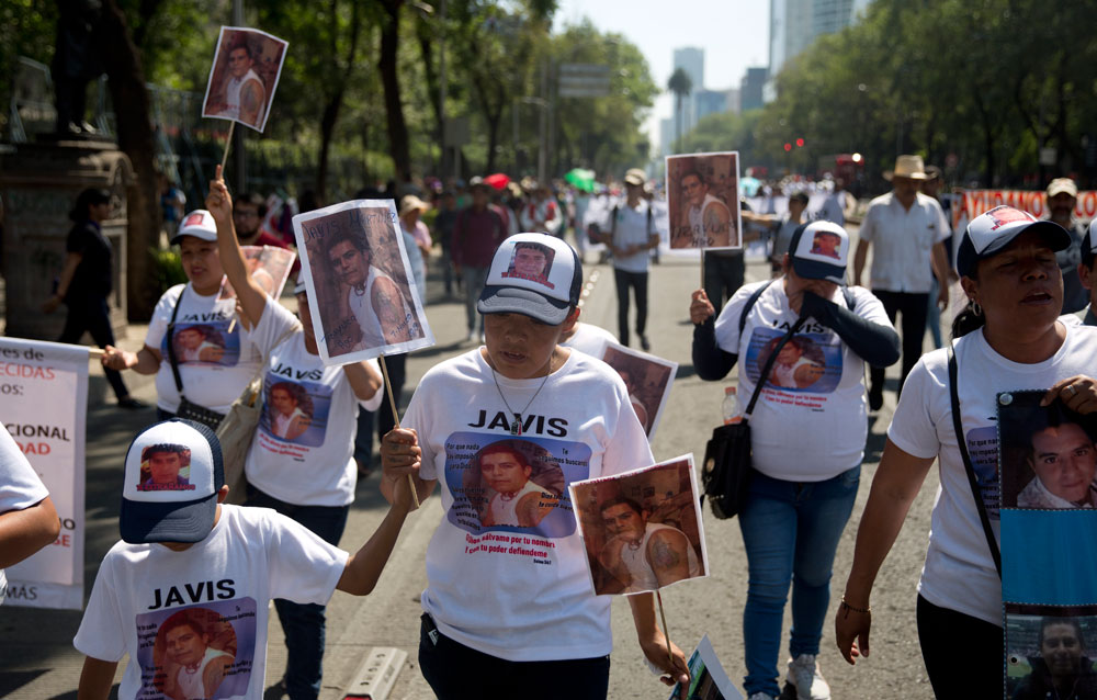 Protesters with images of people who were disappeared during a Mother's Day march in Mexico City on Friday. Mothers and other relatives of persons gone missing in the fight against drug cartels and organised crime are demanding that authorities locate their loved ones