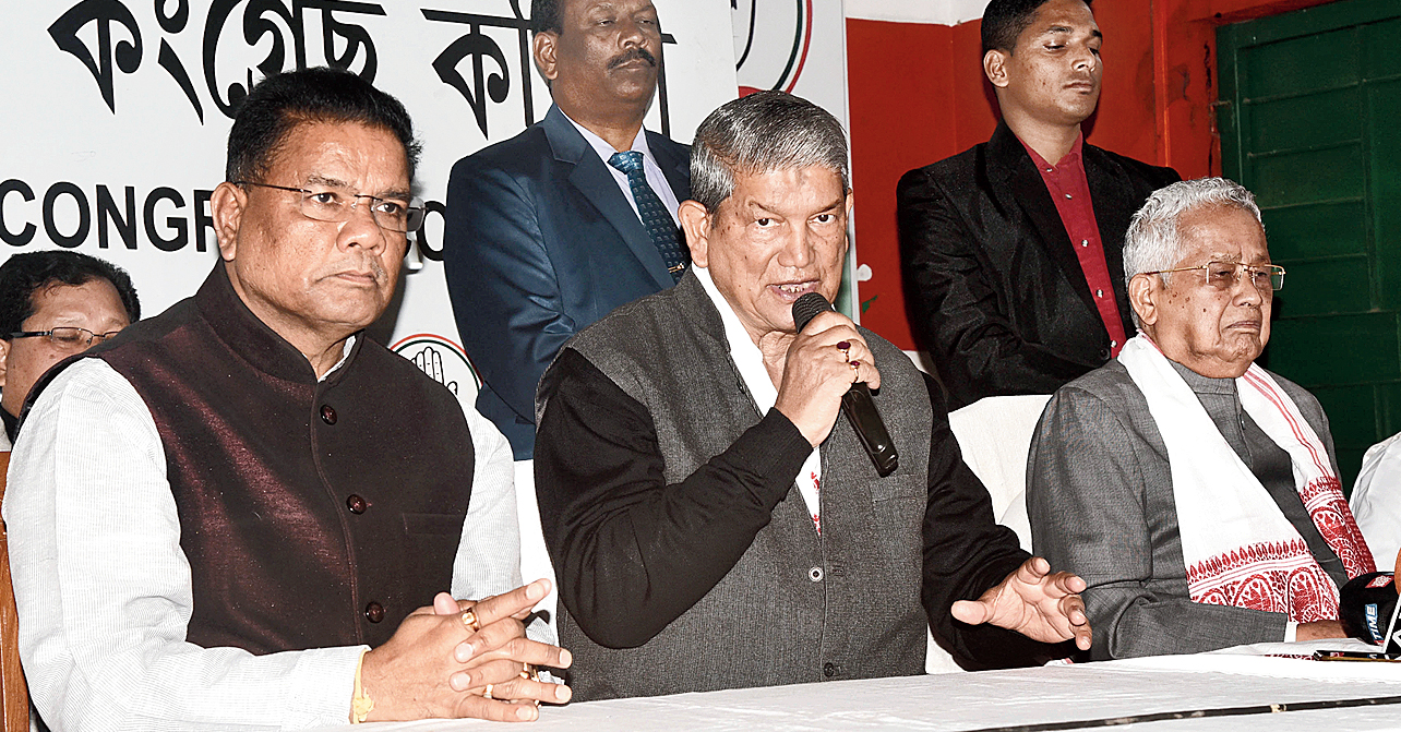 Harish Rawat, flanked by Ripun Bora (left) and Tarun Gogoi, addresses the news conference in Guwahati on Friday. 