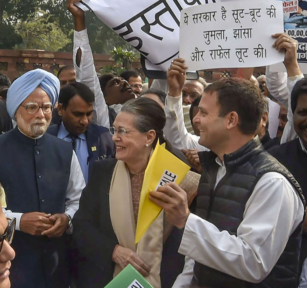 Manmohan Singh, Sonia Gandhi and Rahul Gandhi at a protest over the Rafale deal outside Parliament on Wednesday. 