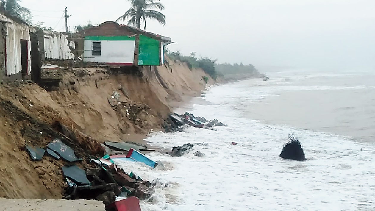 The sea eats into a house at Ramayapatna village in Odisha’s Ganjam district.