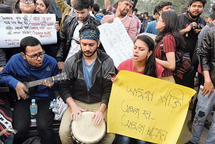 A group of protesters break into a song before the rally