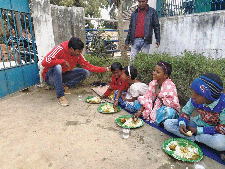 Arjun Haldar with children at Kheribari on Sunday. 

