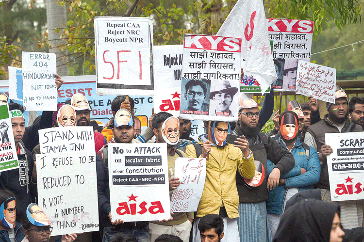 Students display placards at a protest against the CAA and the NRC on Delhi University’s North campus on Thursday. 