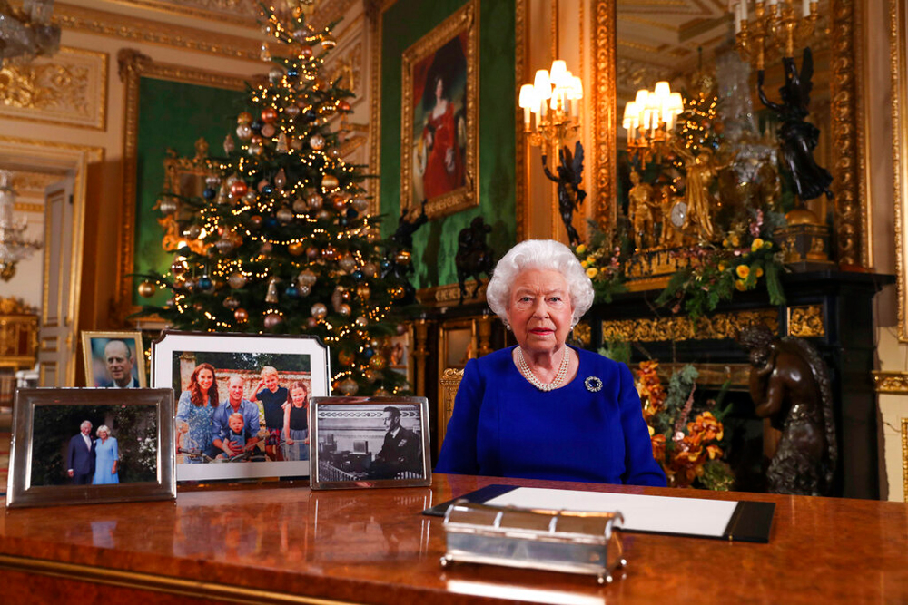 Queen Elizabeth II on December 24 poses for a photo while recording her annual Christmas Day message to the nation at Windsor Castle