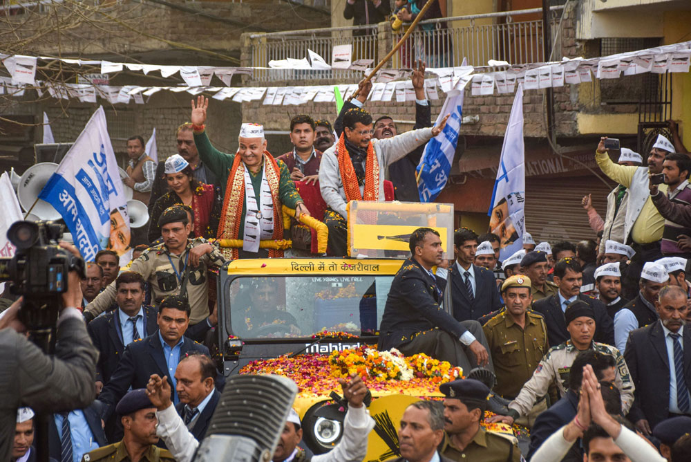 Delhi Chief Minister Arvind Kejriwal during an election campaign roadshow ahead of the State Assembly elections, at Patparganj in New Delhi, on Monday