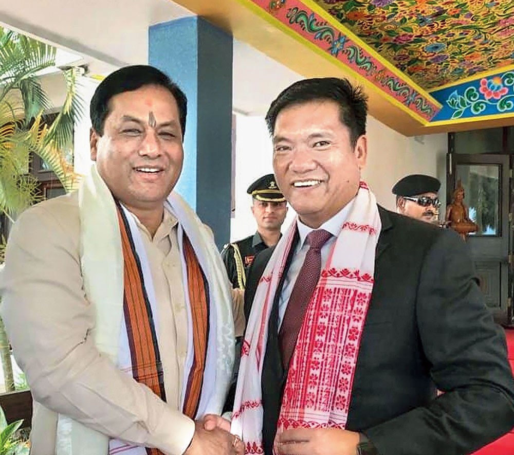 Arunachal Pradesh chief minister Pema Khandu being greeted by his Assam counterpart Sarbananda Sonowal after the oath-taking ceremony in Itanagar on Wednesday