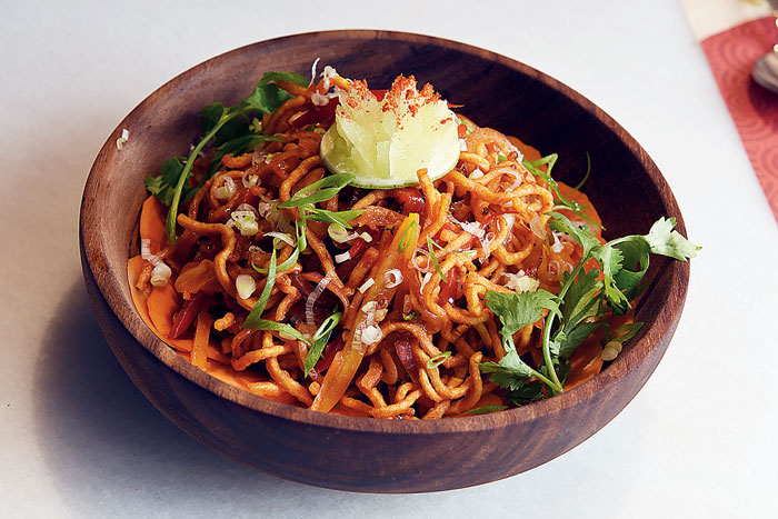 The tangy Tangra-style Chinese Bhel has spices sauteed with stir-fried noodles and makes for a quick, fuss-free snack. 
Rs 195