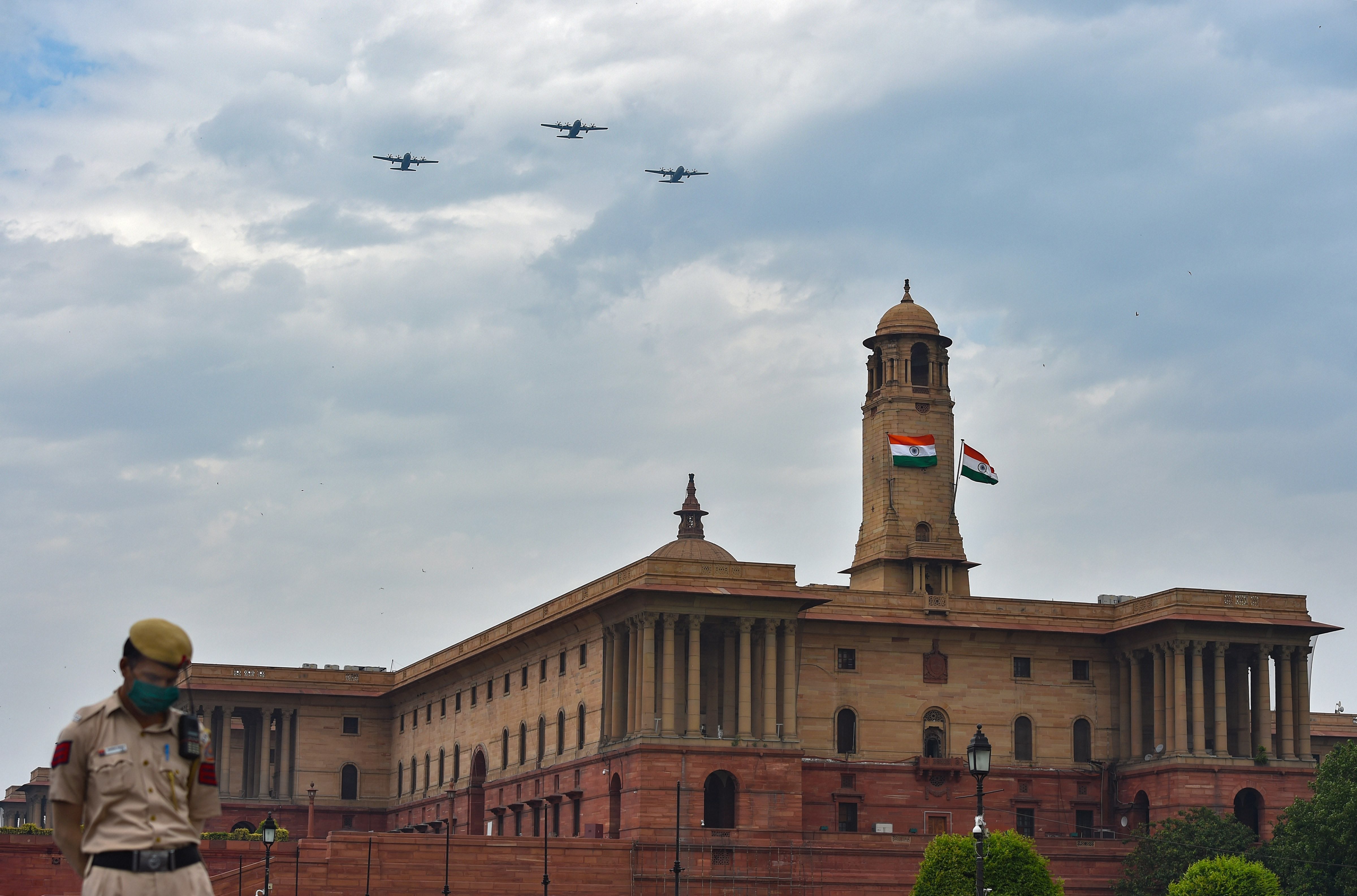 Three C-130 transport aircraft of the Indian Air Force fly over the Raisina Hill to express gratitude towards all frontline workers, including medical professionals, police and sanitation workers for their contribution in fight against Covid-19, in New Delhi, Sunday, May 3, 2020.