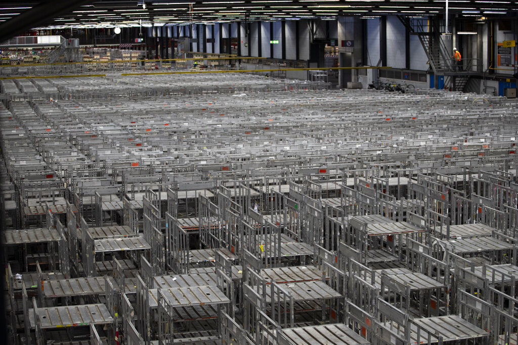 Empty racks are seen at flower auctioneer Royal FloraHolland in Aalsmeer, Netherlands, Thursday, March 19, 2020. Sales at major Dutch growers have slumped, forcing farmers to destroy their flower crops in this busy spring season when bulb fields erupt into color. With lockdowns and border restrictions around the world because of the coronavirus the Netherlands' multibillion dollar flower industry has slumped.